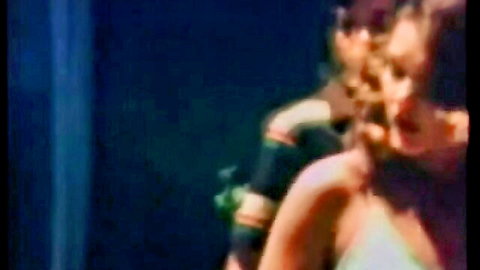 Vintage couple embrace in steamy blue scene from Pretty Girls Dawn classic