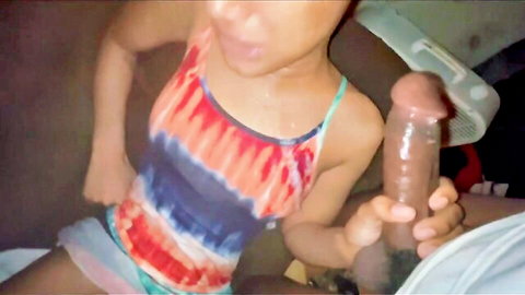 Ebony babe in tie-dye tank top and shorts grips thick realistic dildo POV
