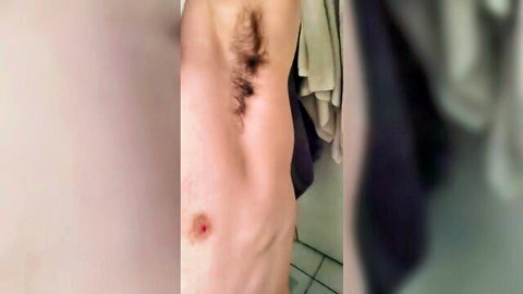 Hairy man showing off armpit and toned torso in solo tease