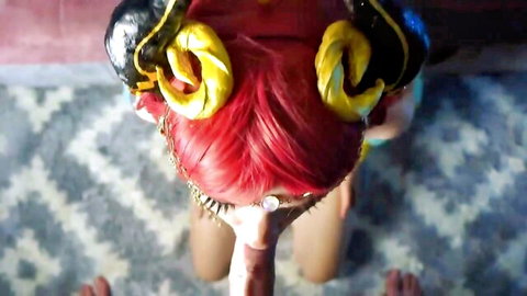 Priva with red hair in devil horns costume kneeling for POV oral