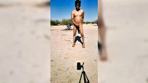 Naked trans woman in desert public nudity with mask and high heels