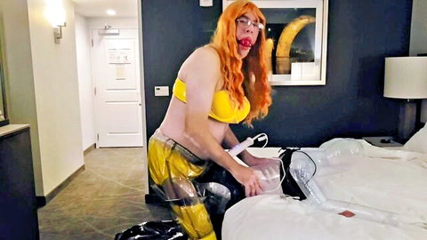 Sissy Diana in yellow bikini top and transparent pants with plastic doll toy