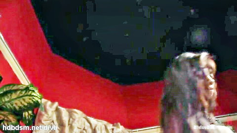 Ebony mistress in red room, dominant pose for rough anal domination scene