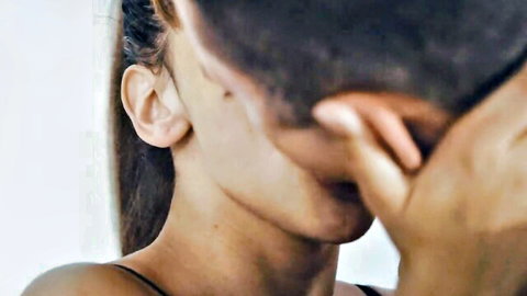 Tommy Cabrio intimately kissing brunette babe's ear close-up