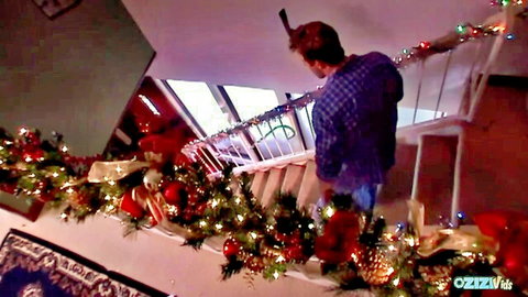 Jodi Bean blowjob scene in festive Christmas home with man on stairs