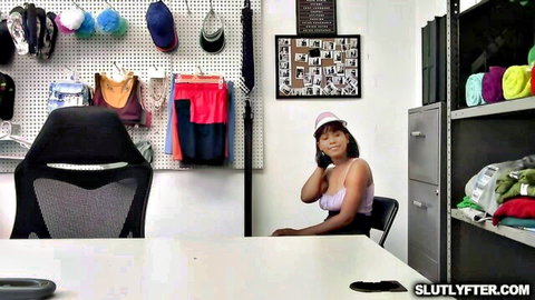 Jenna Foxx ebony model in pink top on phone, teasing cleavage