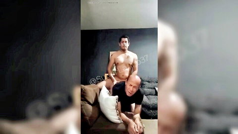 Young Latino man in underwear topping older grandpa in intimate pose