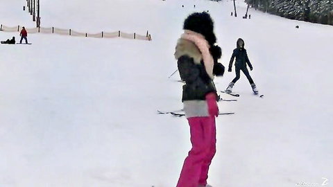 Lesbian teens in pink ski pants and fur jacket on snowy slope, teasing winter foursome fun