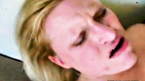 Blonde babe's face with mouth wide open and tongue out during sloppy blowjob
