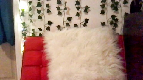 honeyy_89 latina camgirl setup on cozy red chair with fur pillows