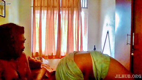 Sexy Indian maid bending over topless in green wrap while cleaning