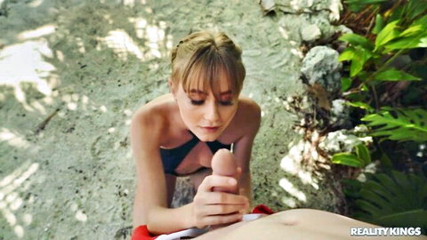Blonde model kneels for outdoor blowjob with Jimmy Michaels on beach