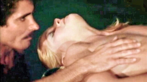 Vintage 1977 blonde nude woman fondled by mustached man in classic adult film