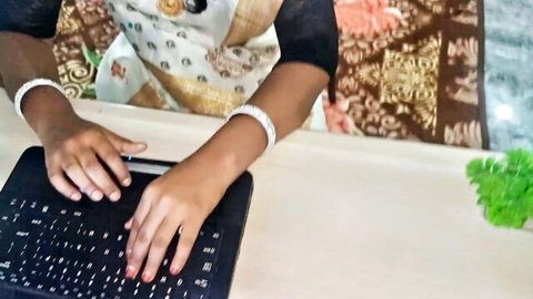 Desi woman in Malayalam saree typing at office desk, adult romance thumbnail