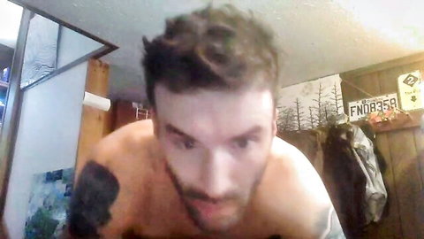 Bearded tattooed muscular man in gay squirt cum tickling orgy video