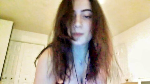 Sagesallow camgirl with long messy brown hair and cleavage in Chaturbate show