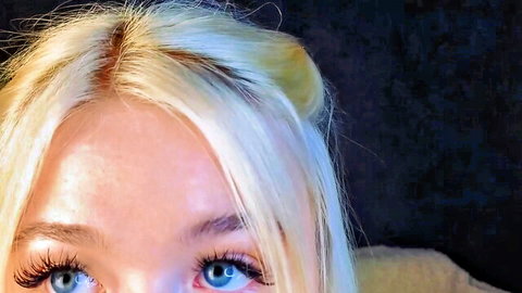 Twinklefluff shy blonde 18yo with piercing blue eyes close-up