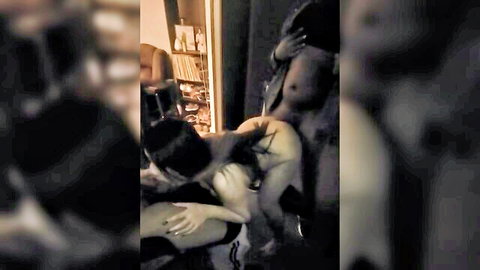 Amateur dark-haired woman bent over getting fucked by two muscular black guys in interracial threesome