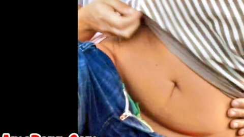 Man's hand pulls up striped shirt exposing toned belly and unzipped jeans teasing pussy
