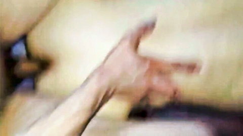 Blurry closeup of hand fingers spreading wet pussy lips