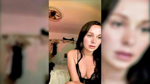 Daisyraexo in black lace bra, seductive pose on bed