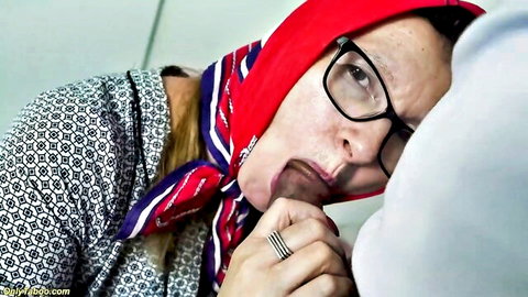 Mature grandma in glasses and headscarf sucking cock in explicit preview