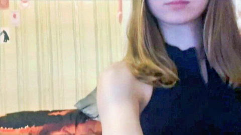 Michelle Neely young shy teen camgirl in black keyhole top, cute blonde pose