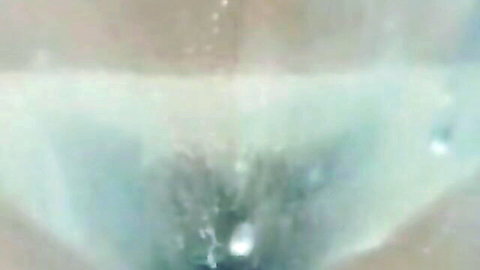 Topless girl with nice tits filmed candidly at the beach