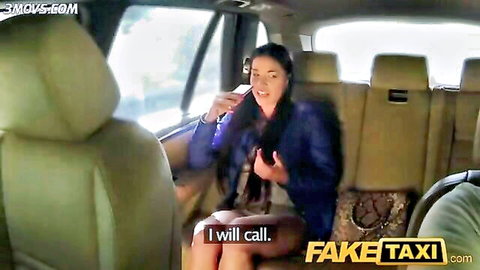 Eveline Dellai in FakeTaxi, smiling woman in blue jacket holding phone in cab backseat
