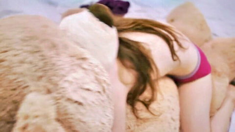 Brunette with exposed tits cuddling giant teddy bears wearing pink panties