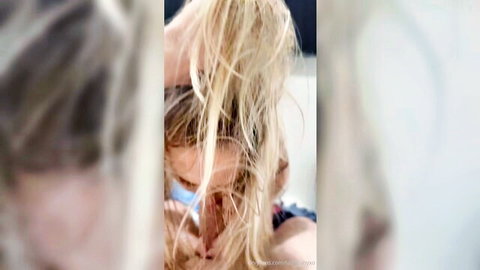 Blonde with wild flying hair over masked face in blurry closeup tease