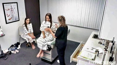 Brunette doctor examines slim patient in gown during steamy clinic visit