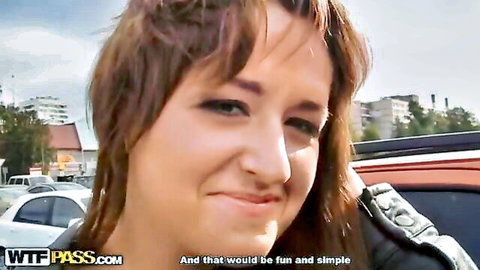 Busty brunette hottie smiling in leather jacket, teasing for front door fun