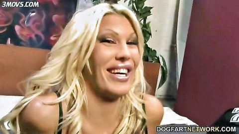 Busty blonde MILF Michelle McLaren smiling in black lingerie