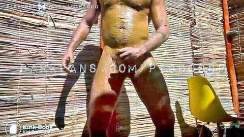 Muscular naked man covered in shit in solo scat fetish scene