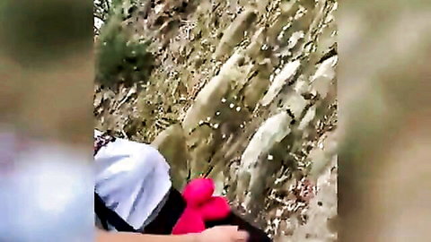 Woman hiking outdoors in white top and red shoes with stranger