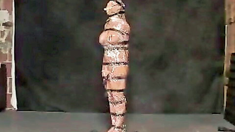 Mummified submissive bound in tight white tape, Insex BDSM solo scene