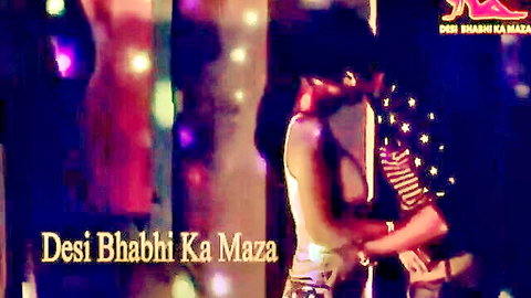 Desi bhabhi in white top embraced intimately by lover, colorful lights