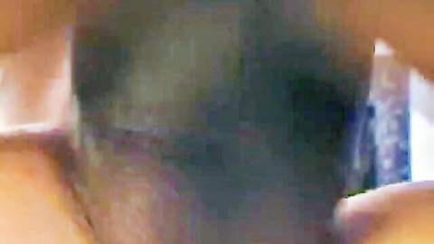 Close-up of thick erect black cock gripped tightly by hand in amateur BBC scene