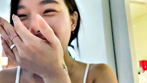 Elle Lee smiling playfully in white camisole, Korean vlog tease