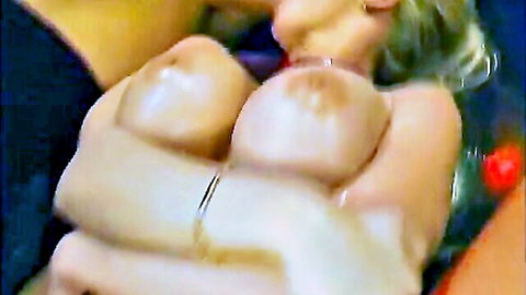 Pale woman with big tits and green hair squeezing breasts nude
