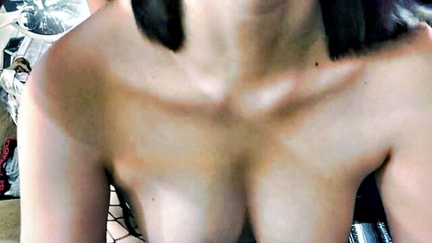 Topless Asian babe with huge natural tits and puffy nipples teasing through fishnets