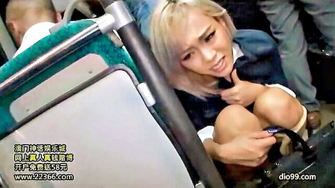 Blonde Asian schoolgirl in uniform fingers herself on crowded bus