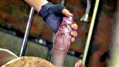 Gloved hand holds bloody purple dildo in Jill y zombi zombie horror scene