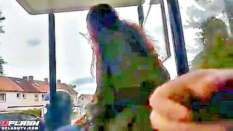 Brunette with long wavy hair in bus public scene