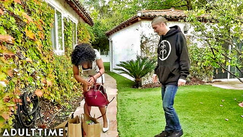 Misty Stone bends over in short dress as neighbor eyes her curves outdoors