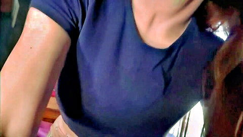 Seductive stepmom in tight navy blue t-shirt, teasing cleavage view