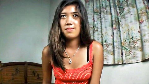 Cute Asian babe in sexy red polka dot camisole top teasing deep cleavage