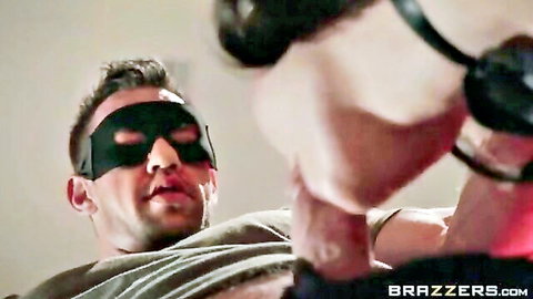 Leather-gloved hand strokes big hard cock of muscular man wearing black mask