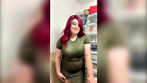 FNTwink in tight green dress, curvy redhead posing seductively